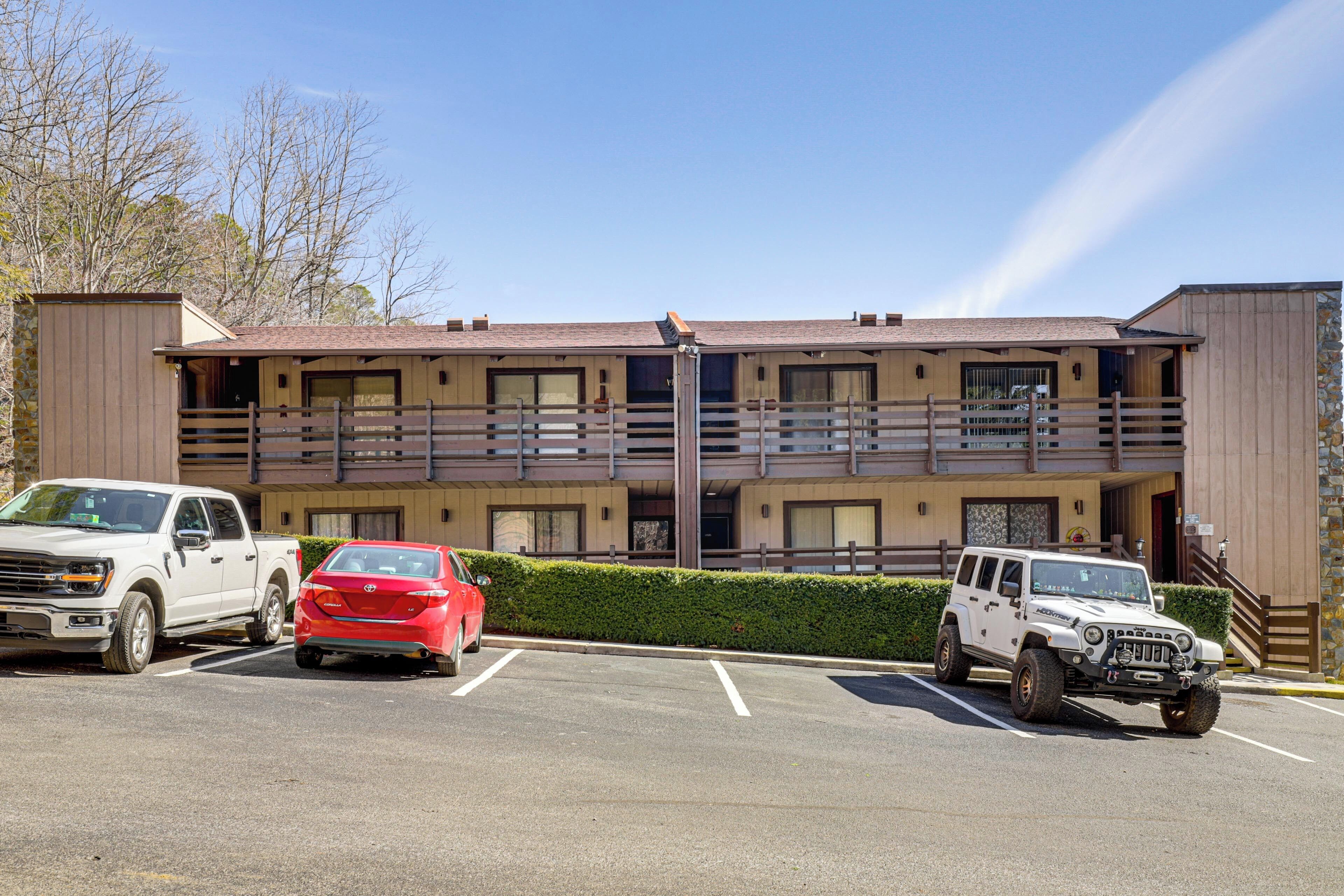 A multi-story building with a parking lot.