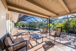 Terrace/patio - Manatees, kayaks, bikes, heated pool & canal, 4 min to the beach, 4 BR.  Luv it! (Bonita Springs)