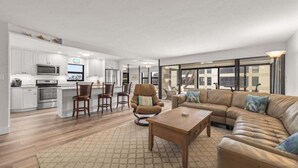 A modern apartment with a kitchen, dining area, and living room. - Kings Crown Unit 212 2 Bedroom Condo (Sanibel)