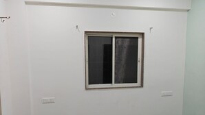 A room with a large window, white walls, and a tiled floor. - Beautiful 1-bedroom bungalow in pleasant Pune neighborhood (Pune)