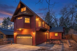 A two-story house with a garage, a balcony, and a well-lit exterior. - Powder and Pines on Knight, walk to the village (Big Bear Lake)