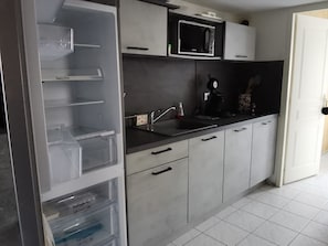 Fridge, microwave, stovetop, coffee/tea maker