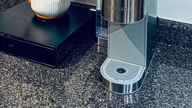 A coffee maker on a countertop with a decorative jug beside it. - yonge & finch subway cozy rooms for rent (Toronto)