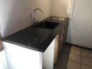 Fridge, microwave, stovetop, coffee/tea maker