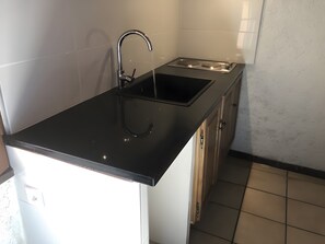 Fridge, microwave, stovetop, coffee/tea maker