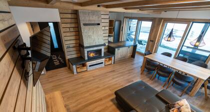 Vila Klif, a spacious vacation home near the ski slopes with a sauna and patio.