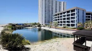 A modern hotel with multiple floors, a pool area, and a beachside location. - Cozy 2-bedroom condo at Myrtle Beach Resort (Myrtle Beach)