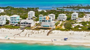 A coastal hotel with multiple buildings, a beach, and a pier. - Beachfront House - Casa Bella Del Sol (Port St. Joe)