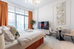 Deluxe Studio | Premium bedding, memory foam beds, in-room safe, blackout drapes