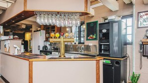A bar area with a counter, multiple taps, and a refrigerator. - Standard Cabin For, 5 Pers, 25m2 (Ronde)