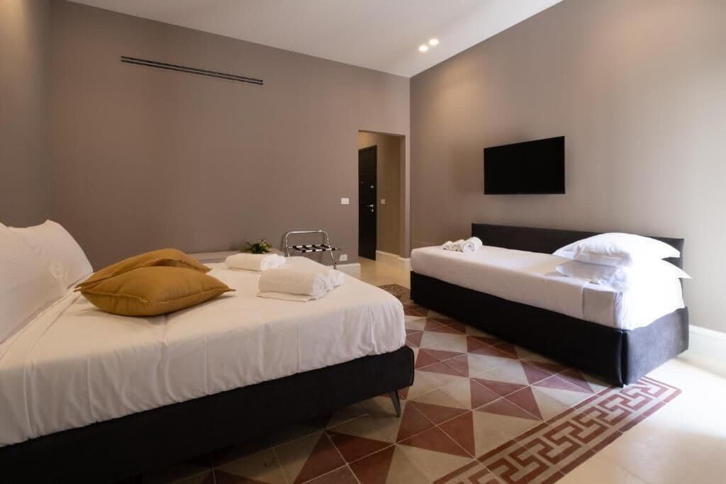 Deluxe Apartment, Balcony, Courtyard View | Blackout drapes, soundproofing, iron/ironing board, free WiFi