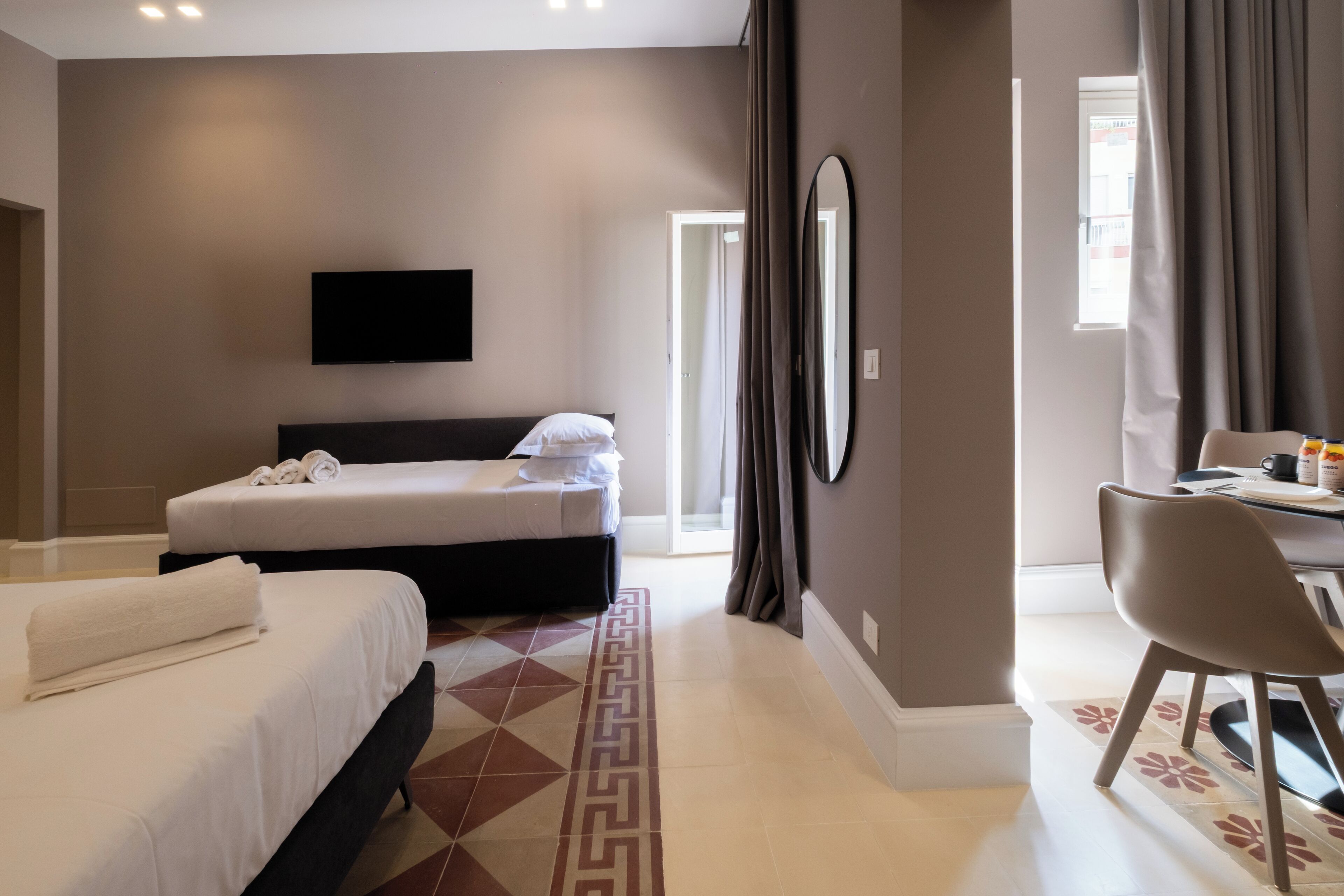 Deluxe Apartment, Balcony, Courtyard View | Blackout curtains, soundproofing, iron/ironing board, free WiFi