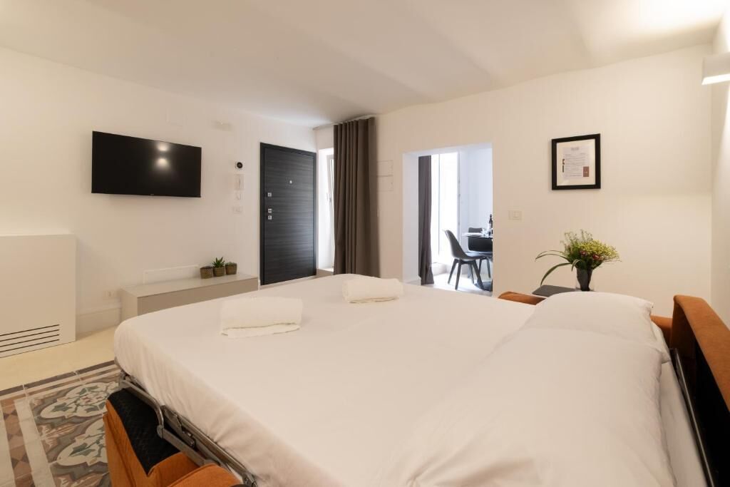 Apartamento família, vista para o pátio | Cortinas blackout, quartos à prova de som, ferros/tábuas de passar roupa