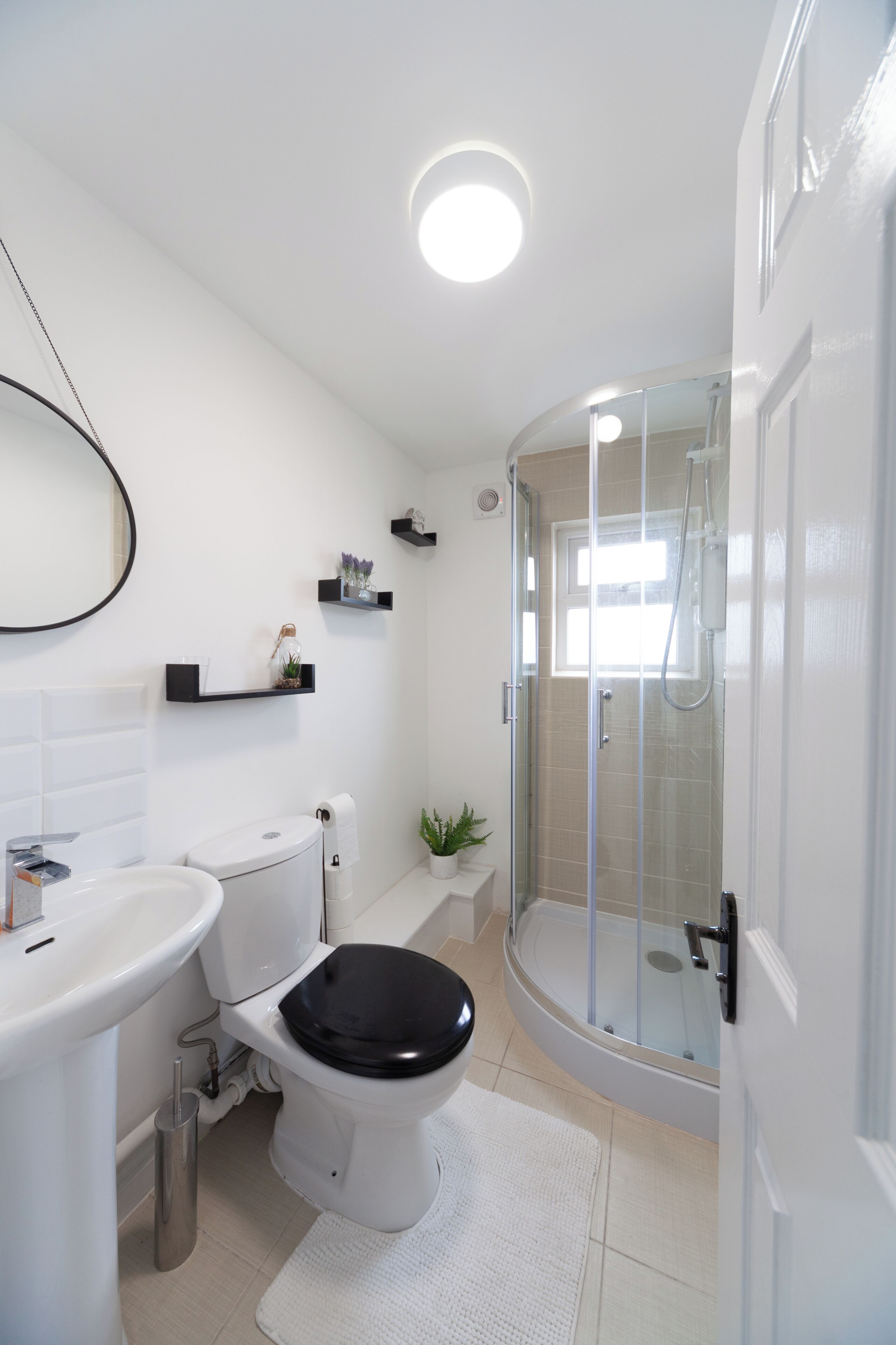 Shower, hair dryer, towels, toilet paper