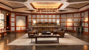 A spacious lobby with a central seating area, a reception desk, and a modern chandelier. - Spacious 3-bedroom, 3.5 Bath Exclusive Ritz-Carlton Resort in gorgeous Vail (Vail)