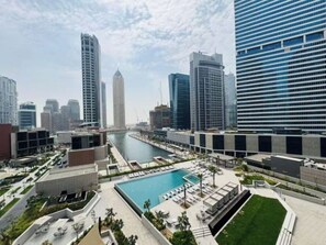 Pool - Curated High-Floor 1BR / Water View / Peninsula 1 (Dubai)