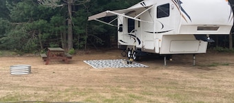 Cozy fifth wheel located on a private campground in Interlochen.