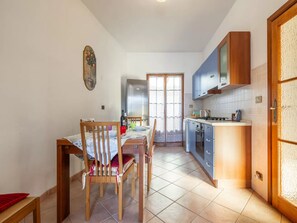 Apartment, 3 Bedrooms, Patio, Garden View | Dining room - A Welcoming Ground-floor Accommodation (Porto Torres)