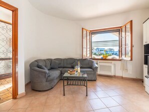 Apartment, 3 Bedrooms, Patio, Garden View | Living room - A Welcoming Ground-floor Accommodation (Porto Torres)