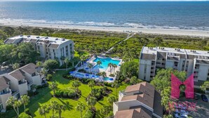 A resort with a pool, beachfront view, and multiple buildings. - MyStay at 136 Shorewood | Ocean + Pool Views | Walk to Coligny | Sleeps 6 (Hilton Head Island)