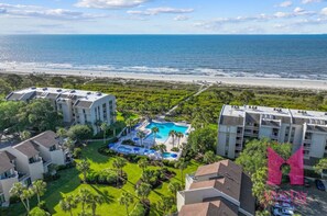 A resort with a pool, beachfront view, and multiple buildings. - MyStay at 136 Shorewood | Ocean + Pool Views | Walk to Coligny | Sleeps 6 (Hilton Head Island)