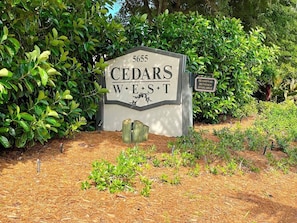 A sign with 'CEDARS WEST' and a number '5655' indicating a location. - Walk-Out Beachfront Condo | Sleeps 7 | Heated Pool | Old Florida Charm (Longboat Key)