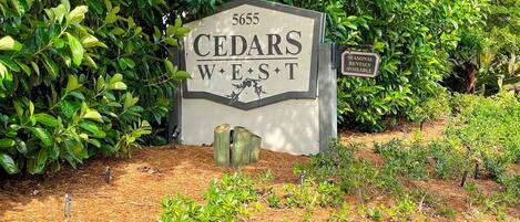 A sign with 'CEDARS WEST' and a number '5655' indicating a location.