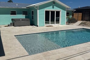 A swimming pool with a house in the background. - Sea-turtle (St. Augustine)
