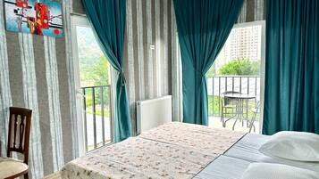 Desk, blackout curtains, soundproofing, iron/ironing board