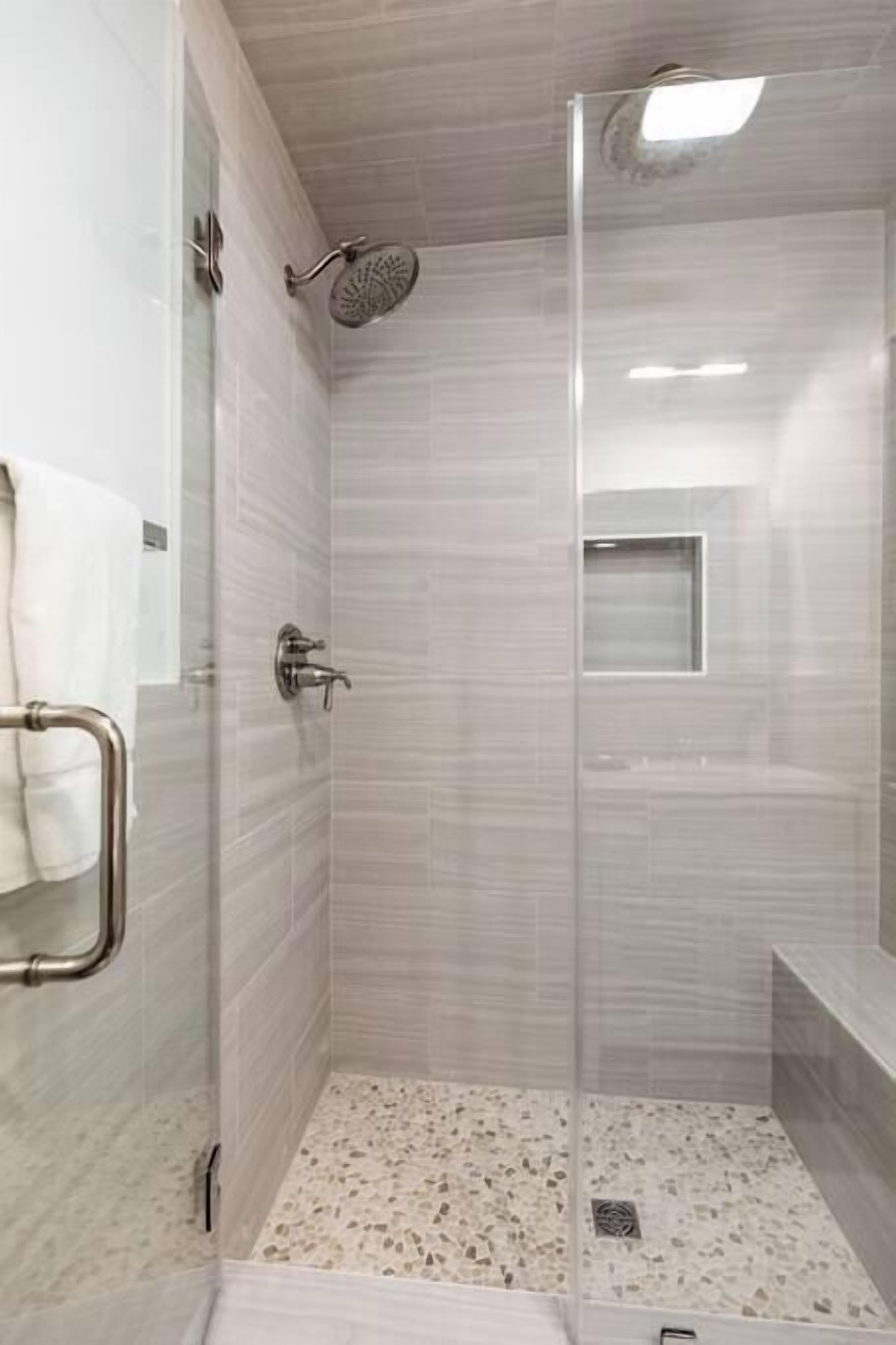 Shower, hair dryer, towels, shampoo