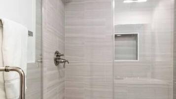 Shower, hair dryer, towels, shampoo