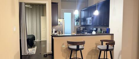 Fridge, microwave, stovetop, cookware/dishes/utensils