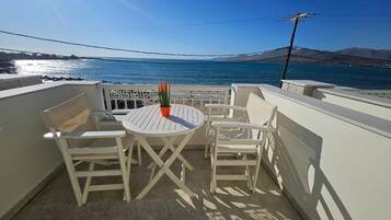 Deluxe Quadruple Room, Balcony, Sea View | Outdoor dining
