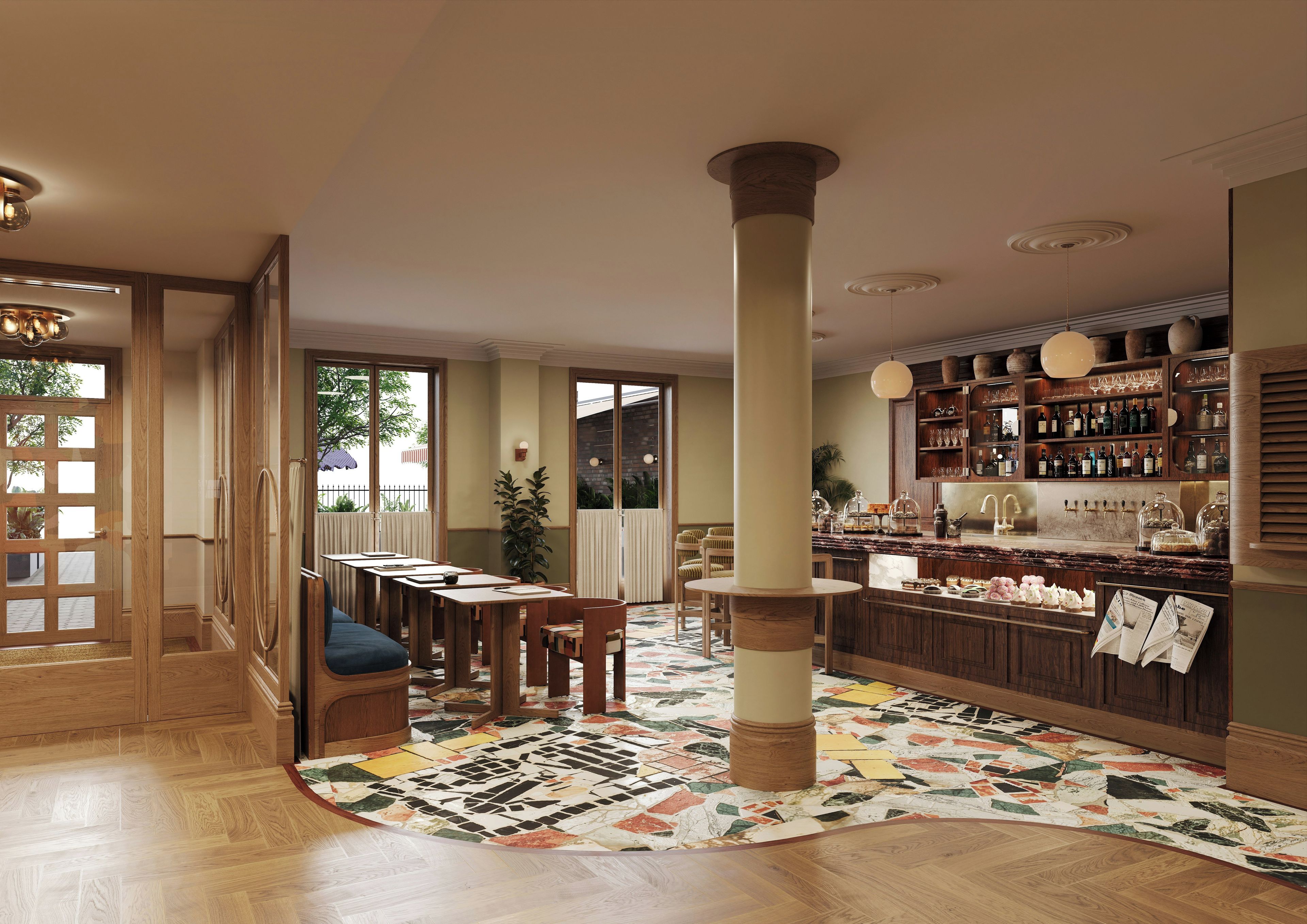 A spacious bar area with a wooden bar counter, seating, and a patterned floor rug.