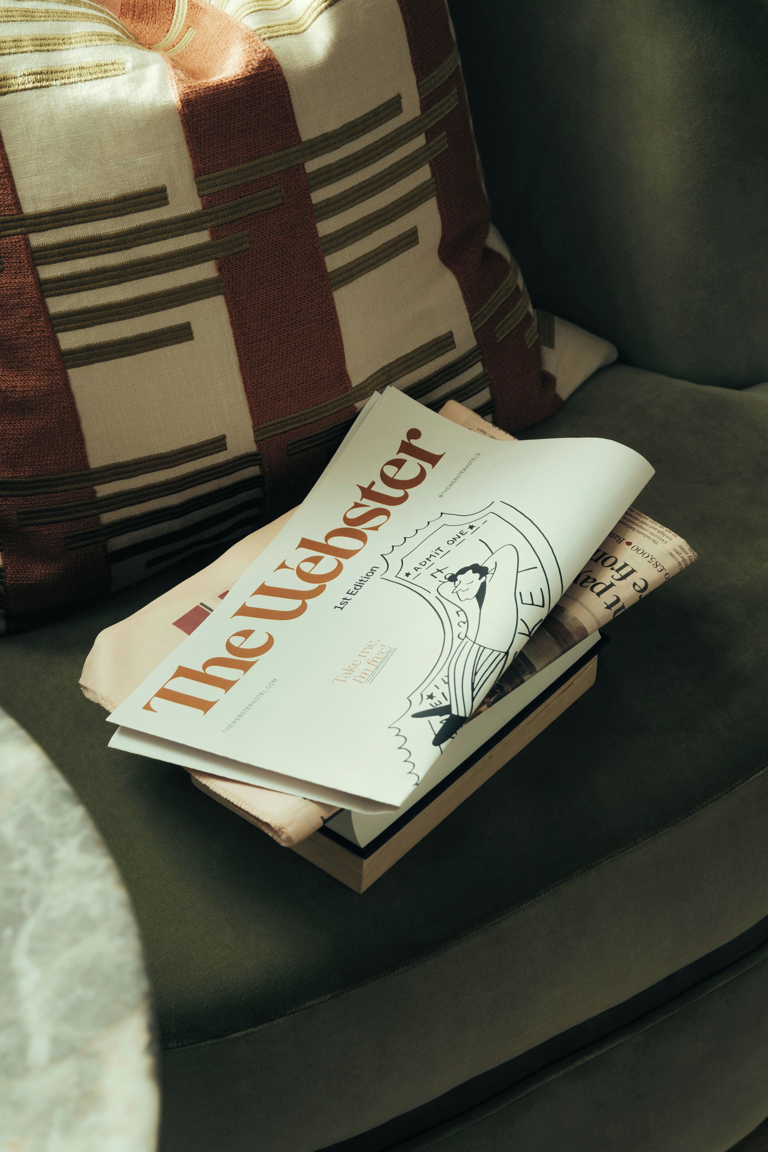 A magazine on a cushion.