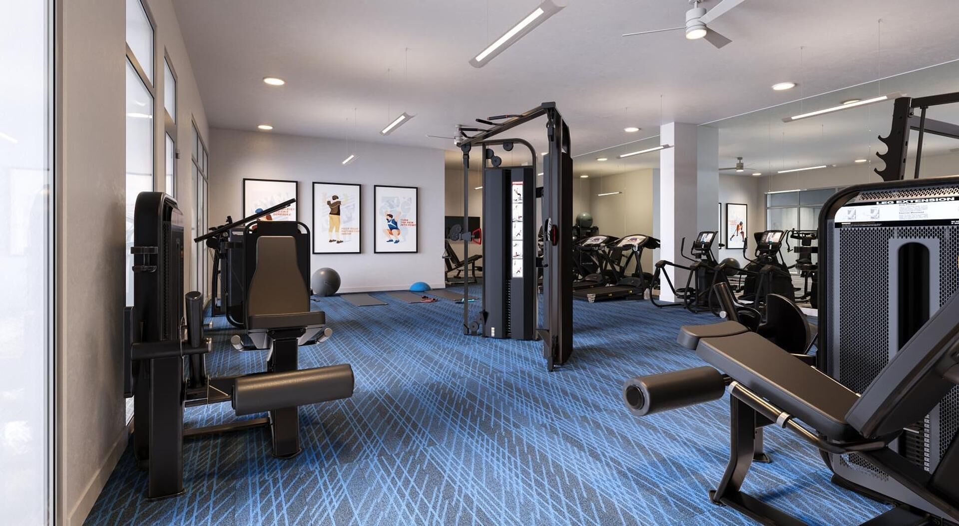 Un gimnasio con máquinas de cardio, equipo de levantamiento de pesas y un espejo grande.