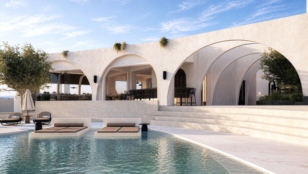 A pool area with lounge chairs and a clear sky. - Mamay Hotel (Santorini)