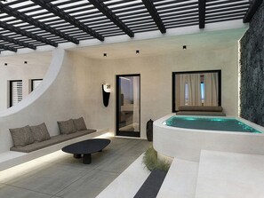 A modern indoor pool area with a sofa, a table, and a wall-mounted number sign. - Mamay Hotel (Santorini)