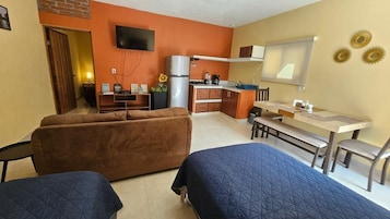 Suite Confort, baño privado | Zona de estar