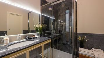 Luxury Quadruple Room, Courtyard View | Bathroom | Shower, hair dryer, towels, soap