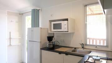 Fridge, coffee/tea maker, highchair, cookware/dishes/utensils