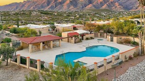 A resort with a swimming pool, lounge chairs, and a view of mountains. - Spacious Catalina Mountain View Retreat 30+ min (Tucson)