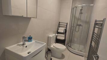 Shower, hair dryer, towels, soap