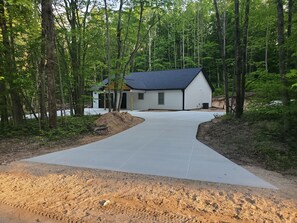 Exterior - Newly built barndominium in the forest. (Manton)