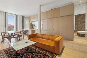 TV, offices - Chic 2BR in Historic Schoolhouse w/ Private Balcony and Gated Parking (New Orleans)