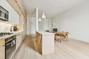 Fridge, microwave, oven, stovetop - Chic 2BR in Historic Schoolhouse w/ Private Balcony and Gated Parking (New Orleans)