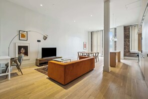TV, offices - Chic 2BR in Historic Schoolhouse w/ Private Balcony and Gated Parking (New Orleans)