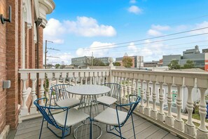 Outdoor dining - Chic 2BR in Historic Schoolhouse w/ Private Balcony and Gated Parking (New Orleans)