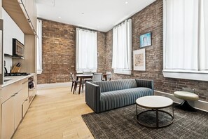 TV, offices - Chic 1BR Near Downtown | Parking and Gym Included (New Orleans)
