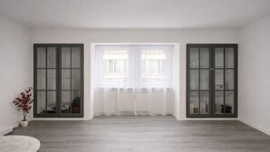 A spacious room with a large window, two sliding glass doors, and a marble floor. - Living on the Rhine: Central, spacious & by the cathedral! (Köln)